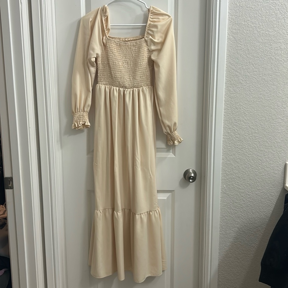 Ivory long sleeve dress.